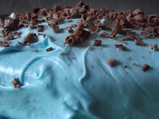 blue frosting with chocolate shavings