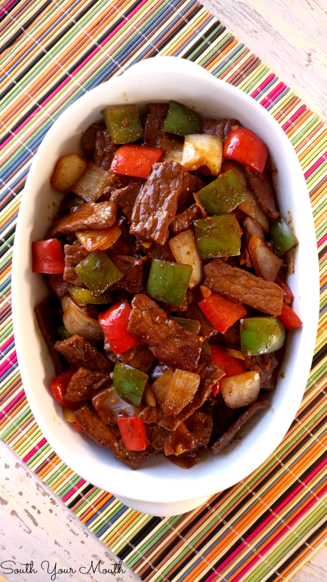 Pepper Steak! Super easy recipe with sauteed steak strips, peppers and onions. PERFECT over rice! 