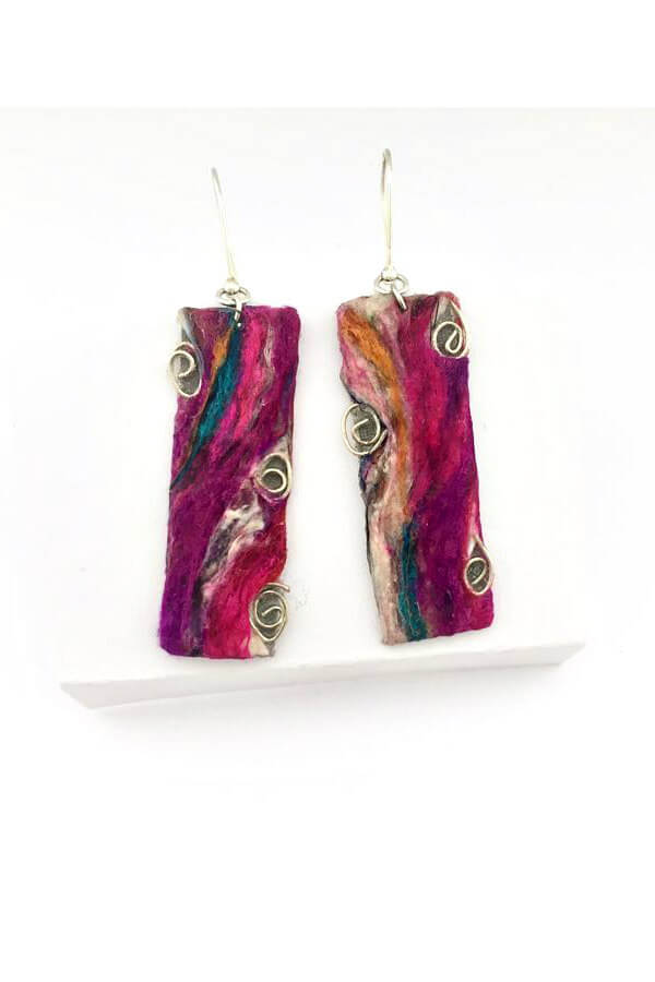 pair of handmade silk thread and coiled silver wire on paper earrings