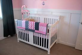 Little baby girl nautical nursery Anchor Themed Room This Would Work Well for Boy Too Project double oar hanged on wall and toys crib