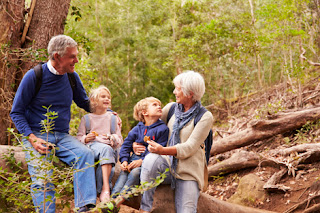Photo of grandparents and grandchildren in the forest