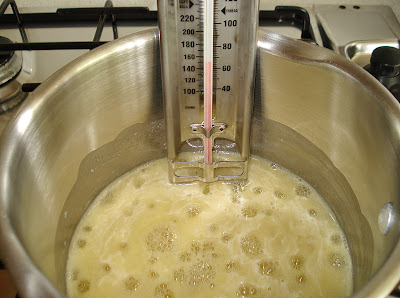 Boil the mixture using a sugar thermometer in the pan.