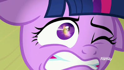 Twilight's about-to-freak-out face in close-up, with the firework fuse reflected in her left (as we look at her) eye