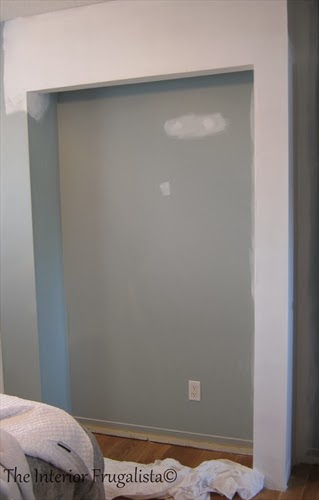 Prepping new drywall on narrow bedroom closet for paint.