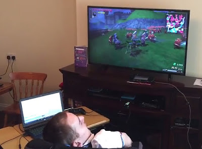 Colin McDonnell playing Hyrule Warriors with a one accessibility switch. Colin McDonnell playing a Nintendo Wii-U (also Nintendo Switch compatible) with a single head-switch.