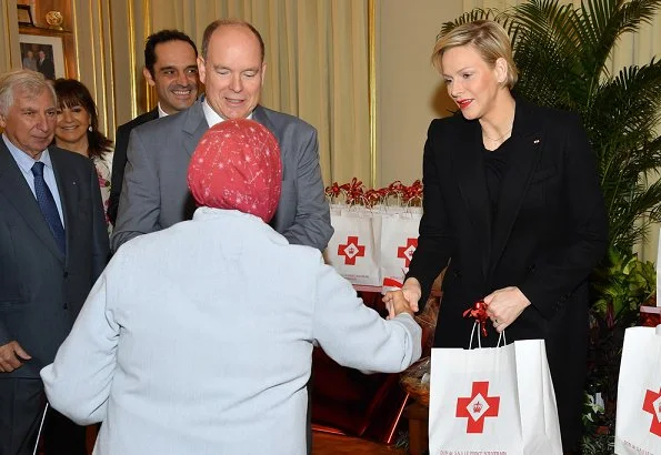 Prince Albert and Princess Charlene distributed gifts to beneficiaries of the Monaco Red Cross on the occasion of the national holiday