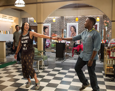 Deon Cole and Margot Bingham in Barbershop The Next Cut