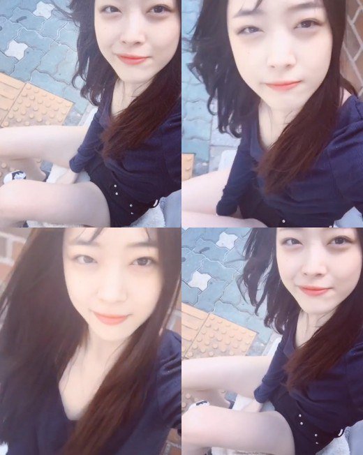 Sulli shows off innocent beauty in the summer breeze