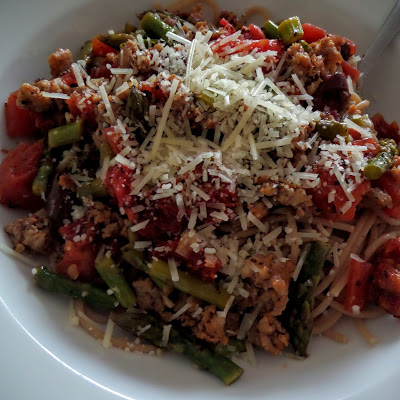 Sun-dried Tomato Olive and Asparagus Pasta:  Sun-dried tomatoes, olives, asparagus and Italian sausage in a chunky pasta sauce served over whole wheat pasta and topped with parmesan.