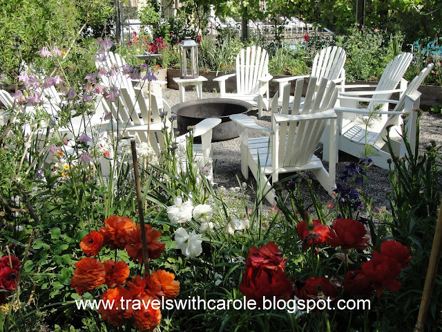 Adirondack chairs surround fire pit at The Farmhouse Inn in Forestville, California Adirondack chairs surround fire pit at The Farmhouse Inn in Forestville, California