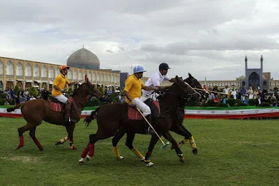 Two polo sport teams are competing in Naqshe jahan Square of Isfahan, Iran