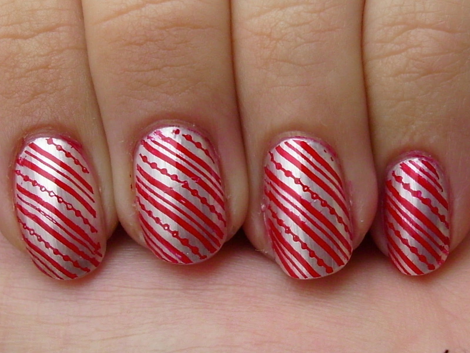 3. Red and White Candy Cane Christmas Nails - wide 9