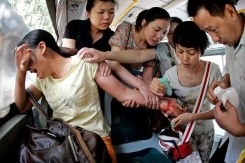A bus of caring people save a woman who tried to commit suicide in China. - The 63 Most Powerful Photos Ever Taken That Perfectly Capture The Human Experience