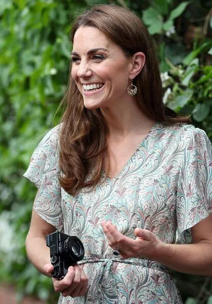 Kate Middleton is wearing a print floral summery midi dress, Castaner wedges and her Catherine Zoraida earrings