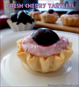 Fresh Cherry Tartlets, fresh juicy cherries and a fluffy cream cheese filling in a quick baked pie crust. | Recipe developed by www.BakingInATornado.com | #recipe #cherry #pie