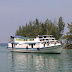 Tour traveling ke pulau harapan melihat matahari terbenam yang mempesona