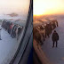 Passengers get out and push frozen Siberian plane