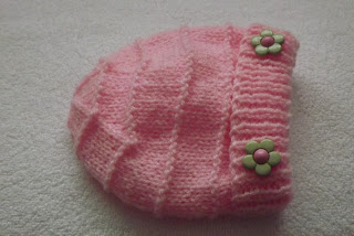 http://www.craftsy.com/pattern/knitting/accessory/baby-pink-hat/131219