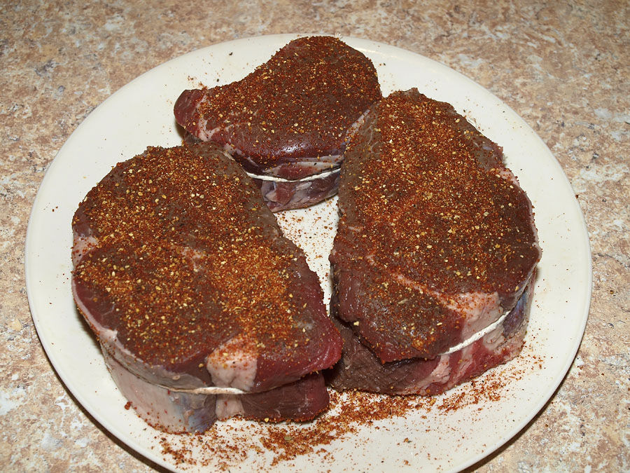 Pellet Smoker Cooking Beef Sirloin Steaks and Baked Potatoes