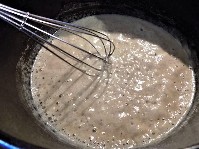 A picture of butter and flour being mixed to make a roux