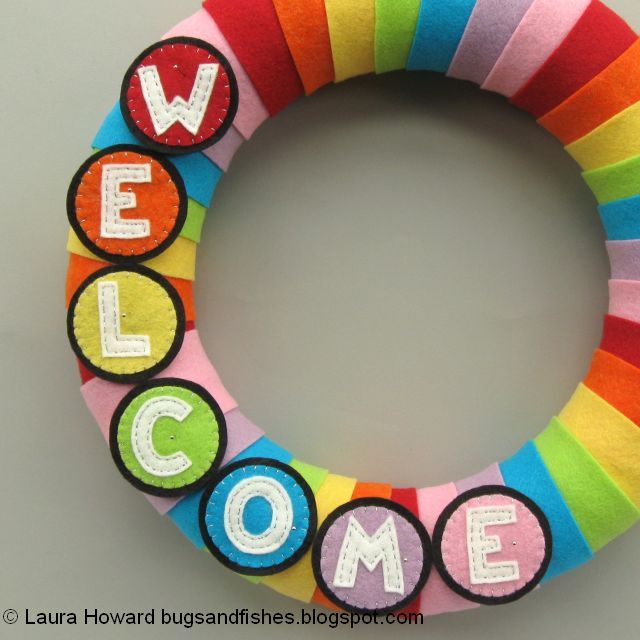 DIY January Rainbow Welcome Wreath Tutorial adding the letters to the rainbow wreath