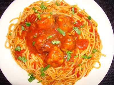 PORTIONS: 3          YIELDS: 15 SMALL MEATBALLS. PORTIONS INGREDIENTS 1 lb. ground chicken 1½ tbsp. olive oil ½ diced small onion 2 minced garlic cloves 1 tbsp. chopped parsley ¼ tsp. ground black pepper ¾ tsp. salt 6 tbsp. breadcrumbs 3 cups chunky tomato sauce ½ lb. spaghetti METHOD Weight, measure and cut ingredients necessary for the recipe. In a bowl mix well ground chicken, onions, garlic, chopped parsley, pepper, salt and breadcrumbs. It does not need eggs. Make 15 meatballs. Heat up a frying pan with the oil and brown the meatballs.  Add the tomato sauce. Bring it slowly to a boil and let it simmer for 15 minutes Cook spaghettis in boiling water with salt for about 10 minutes or according to package instructions. Serve spaghettis with the meatball on top. Serve with Parmesan cheese .