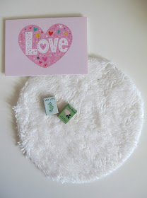 Modern dolls' house miniature Lundby love picture, round white rug and two books.