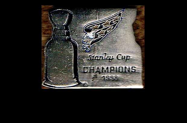 You read the pin right;  these were made in case the Caps had beaten Detroit in the 1998 Finals; now they're proudly worn in some third-world country.