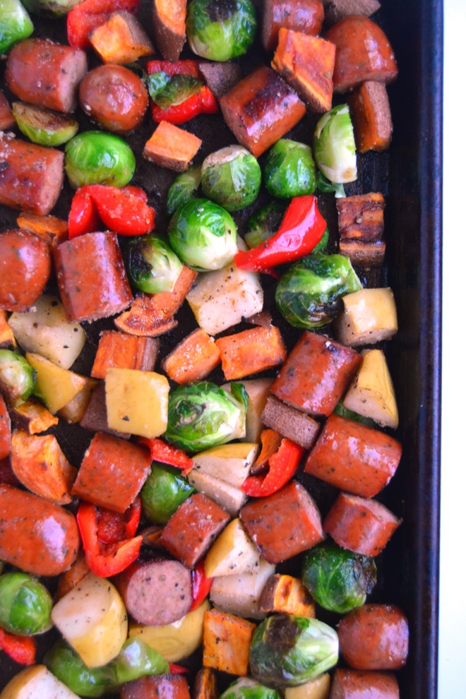 Sheet Pan Sausage, Apples and Vegetables is all made on one pan and is ready in 30 minutes! Loaded with roasted apples, sausage, sweet potatoes, red bell peppers and Brussels Sprouts. www.nutritionistreviews.com