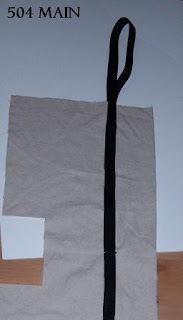 Pin strap in place to the outside of the tote bag.