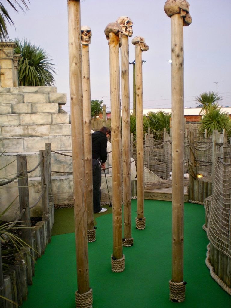 Emily Gottfried in amongst the skulls on spikes at the Lost World Adventure Golf course in Hemsby