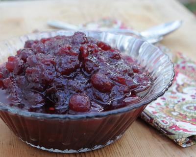 Homemade Whole Cranberry Sauce ♥ KitchenParade.com, the convenience of the slow cooker, the natural sweetness of maple syrup, the sweet aroma of cranberries, fresh ginger and orange zest! Recipe, cooking tips, nutrition and Weight Watchers points included.