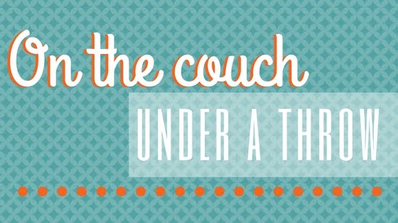 On The Couch Under A Throw