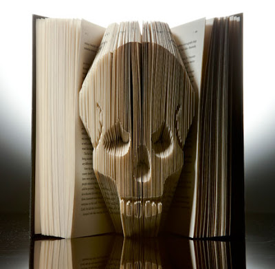 pages folded into the shape of a skull