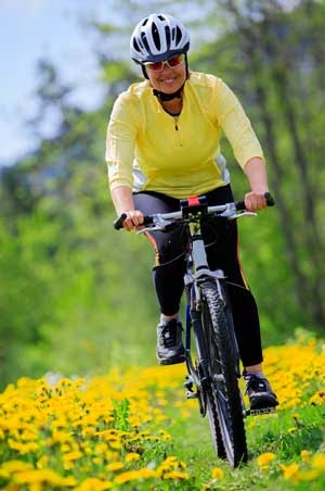 Woman Bicycle Riding in the Spring