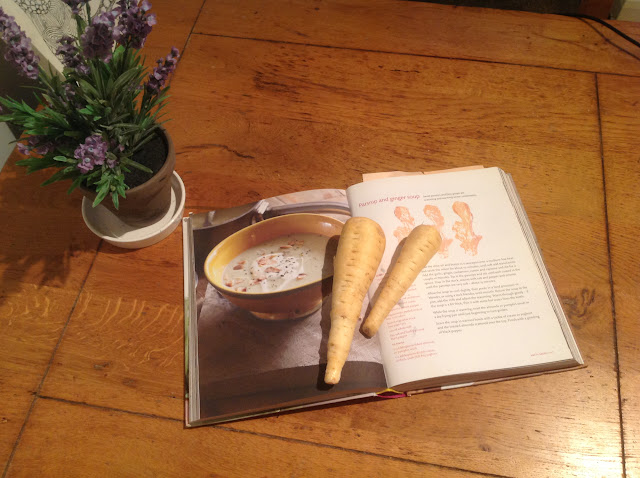 recipe book and lavender on an oak table