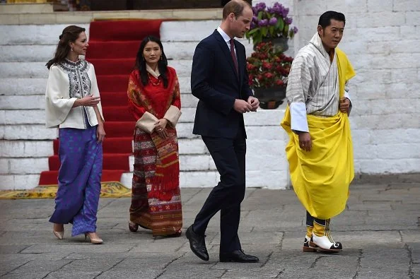 Prince William and Kate Middleton walk with King Jigme Khesar Namgyel Wangchuck and Queen Jetsun Pema from a Buddhist Temple inside the Tashichodzong in Thimphu.