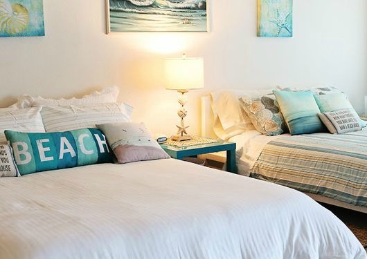 Blue Beach Typography Pillow in Bedroom