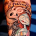 Jack ink and barbie doll tattoo on arm