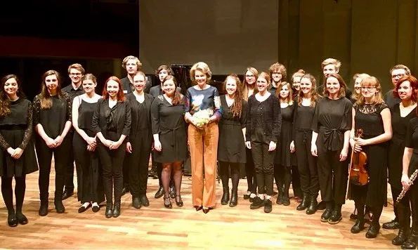 Queen Mathilde of Belgium visited the Luca School of Arts in Leuven. Queen wore Natan blouse and Natan trousers. Mathilde wore Natan coat, and earrings