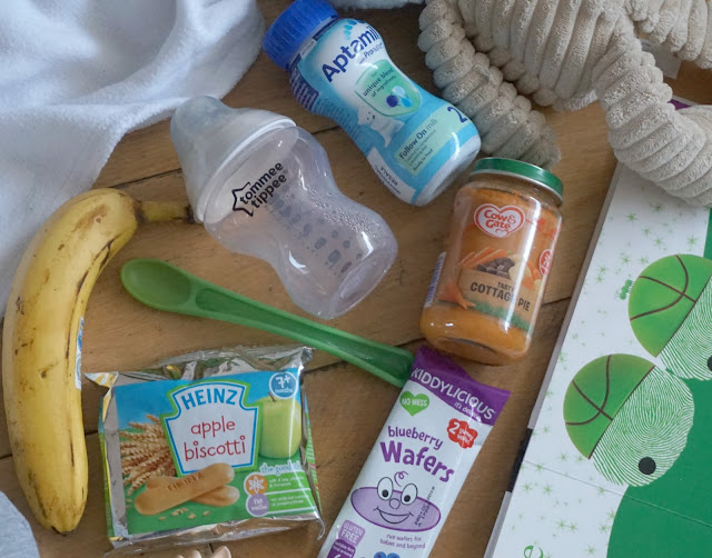 various baby food and snacks flat lay