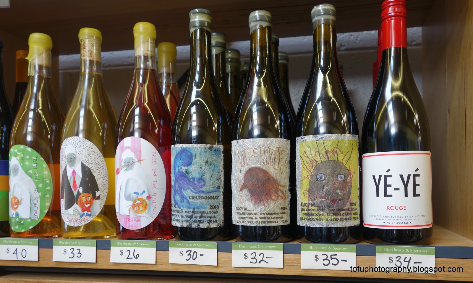 Tofu Photography Hand decorated wine bottles for sale in a shop in