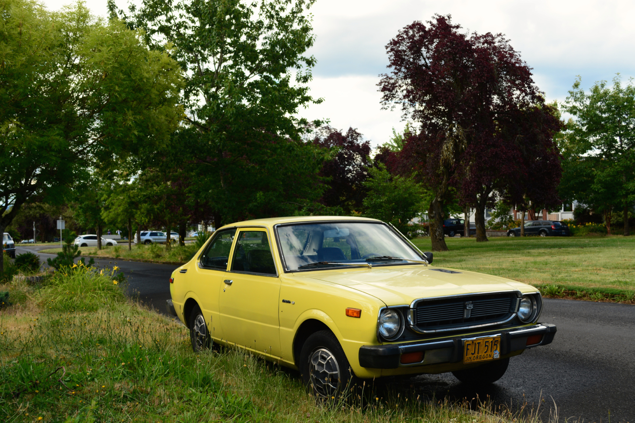 OLD PARKED CARS.: 1975 Toyota Corolla Deluxe.