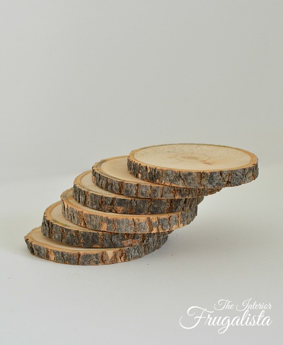 Branch cut into wood slices for Holiday Cocktail Wood Slice Coasters