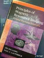 Principles of Magnetic Resonance Imaging: A Signal Processing Perspective, by Liang and Lauterbur, superimposed on Intermeidate Physics for Medicine and Biology.