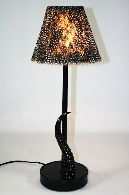 Guinea fowl feathers and Black Springbok Horn Base Lamp © Phases Africa