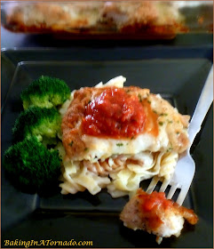 Baked Crispy Chicken Parmesan is full of classic Italian flavors, baked to a crispy crunch, topped with gooey melted cheese and served with marinara sauce. | Recipe developed by www.BakingInATornado.com | #recipe #chicken #dinner