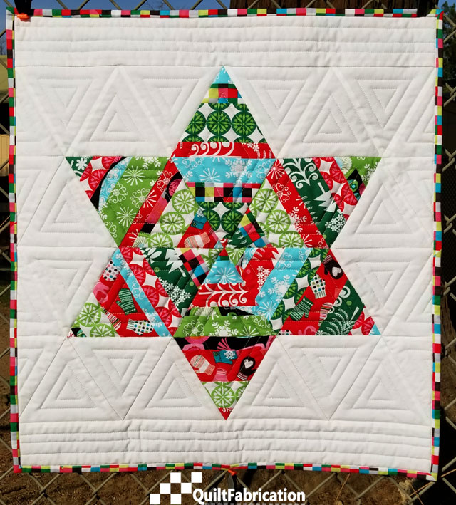 Adorn, in holiday fabrics, from the Make Wall Quilts