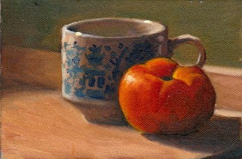 Oil painting of a willow pattern teacup and a red tomato on a chopping board with long afternoon shadows.