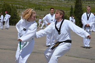 Martial arts girl defending herself with self-defense and taekwondo